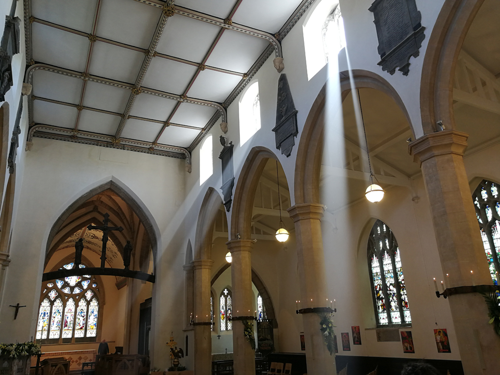 light rays through the windows of a church