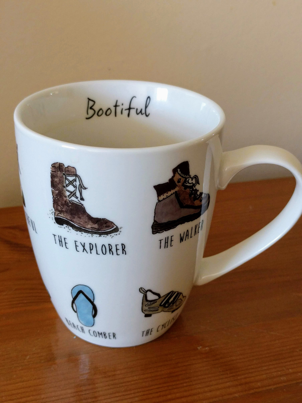 A mug with walking motifs found in a Walkers hotel.