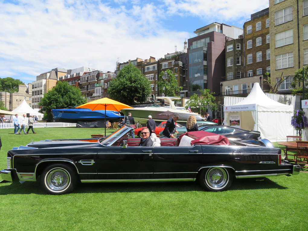 A side view of a black 1978 Lincoln Town car special convertible conversion