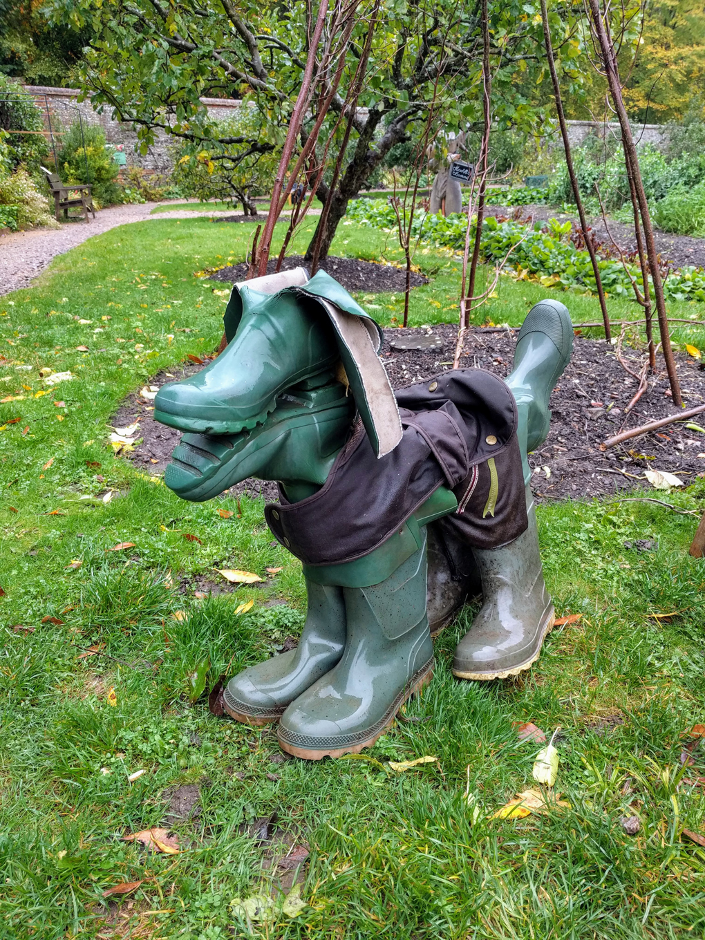 A statue of a dog made from old pairs of wellington boots.