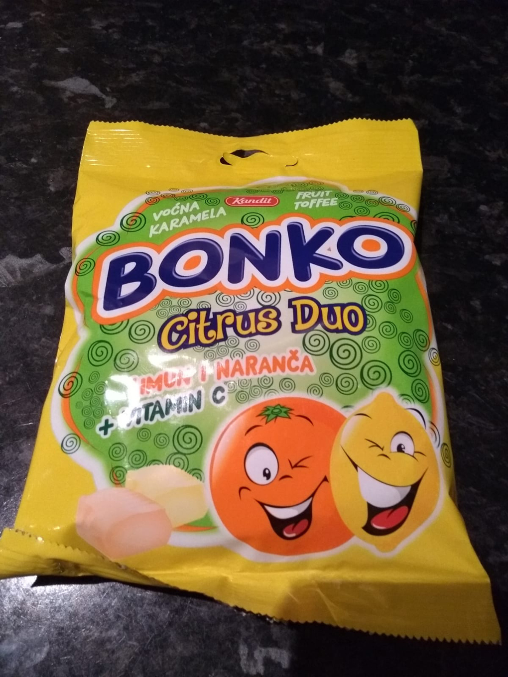 packet of sweets with cartoon lemon and orange on front