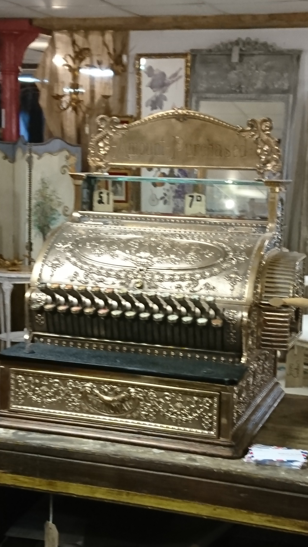 Found in an Antique shop a thing which is rarely beautiful but this one is - a cash register, beautifully made in embossed metal decoration completely gilded - a real piece of art, beautiful!
