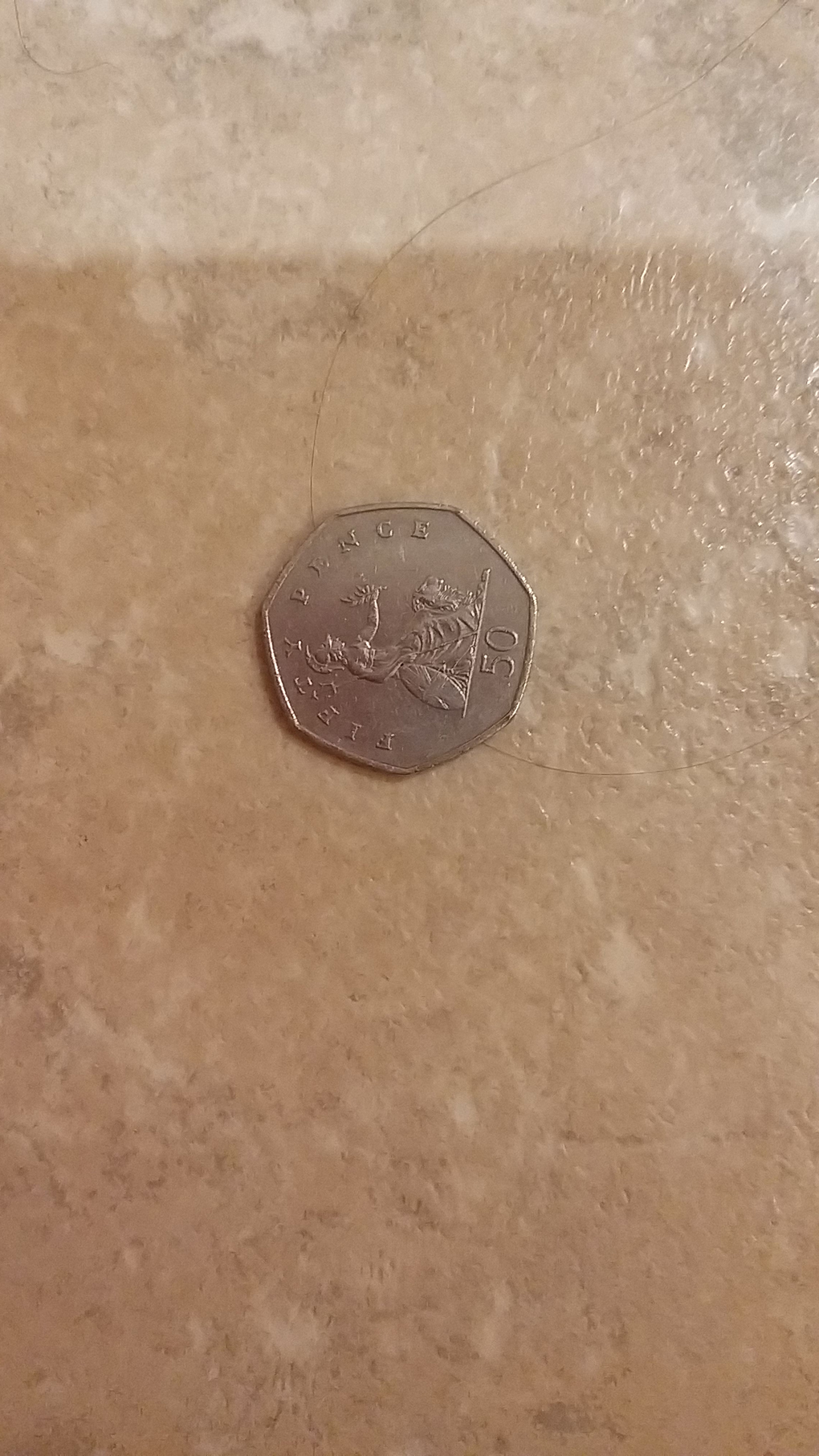 50p coin tails up