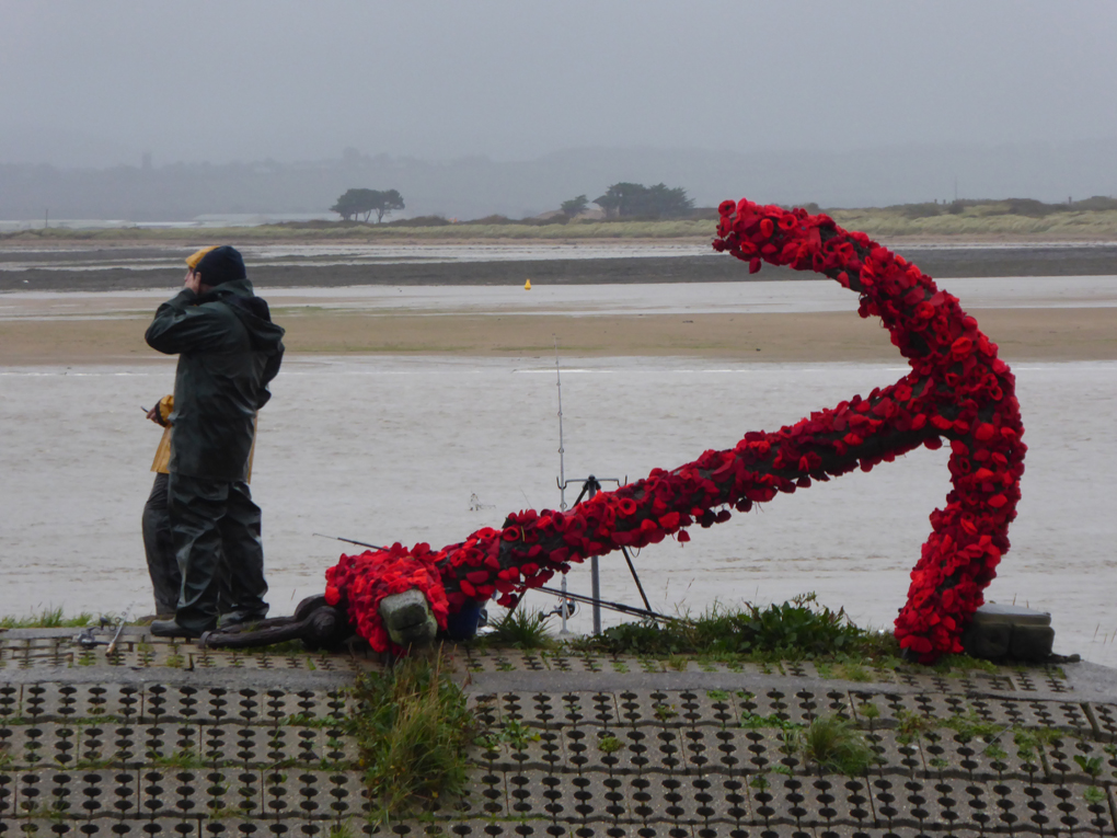 Anchor covered with hand knitted poppies