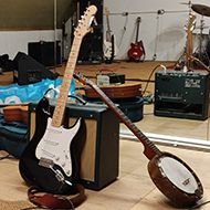 Guitars and amplifiers in a rehearsal studio