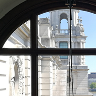 impressive white stone architecture through a circular window