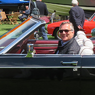 A side view of a black 1978 Lincoln Town car special convertible conversion