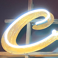 Neon sign of crystal pool with swimmer