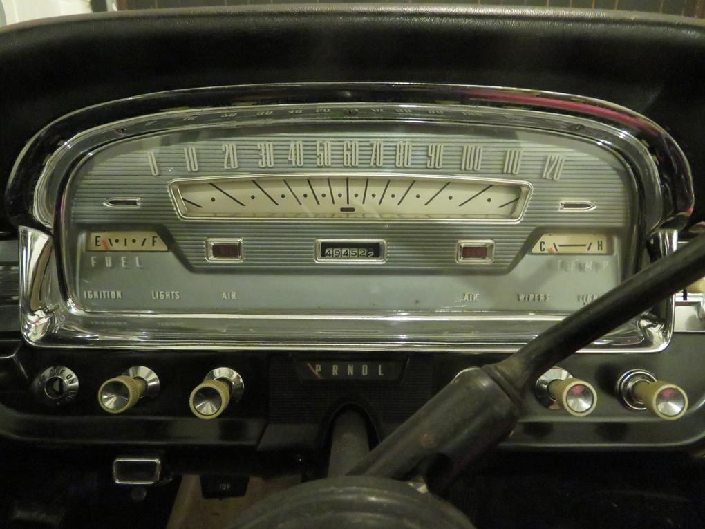 We see a close up of the instrument cluster of a 1959 Ford Galaxie.