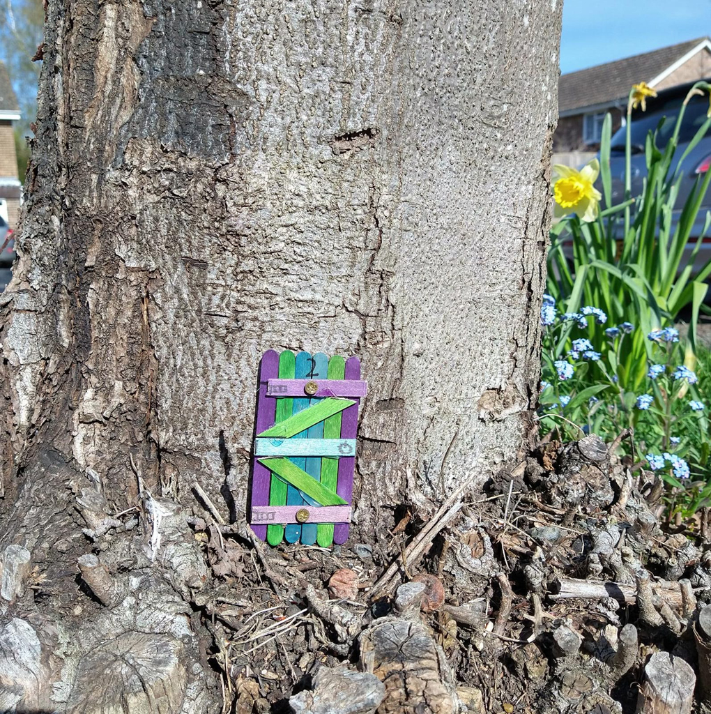 small model door in a tree