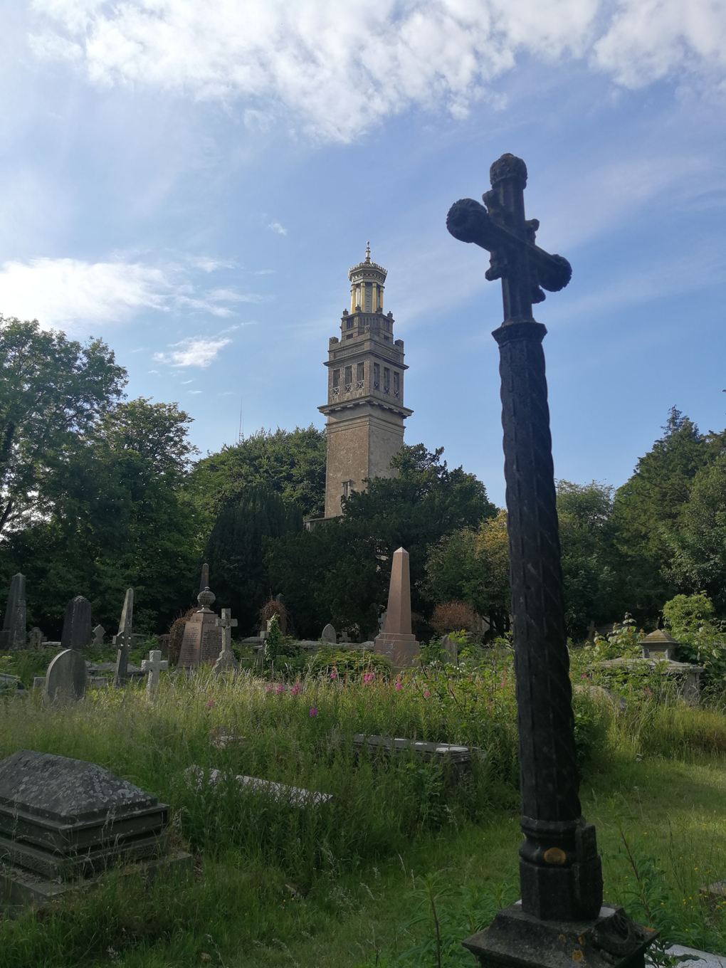 tower viewed through a graveyard