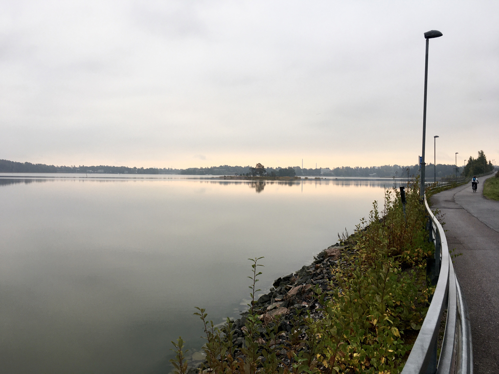 Cycle route next to water in sunrise.