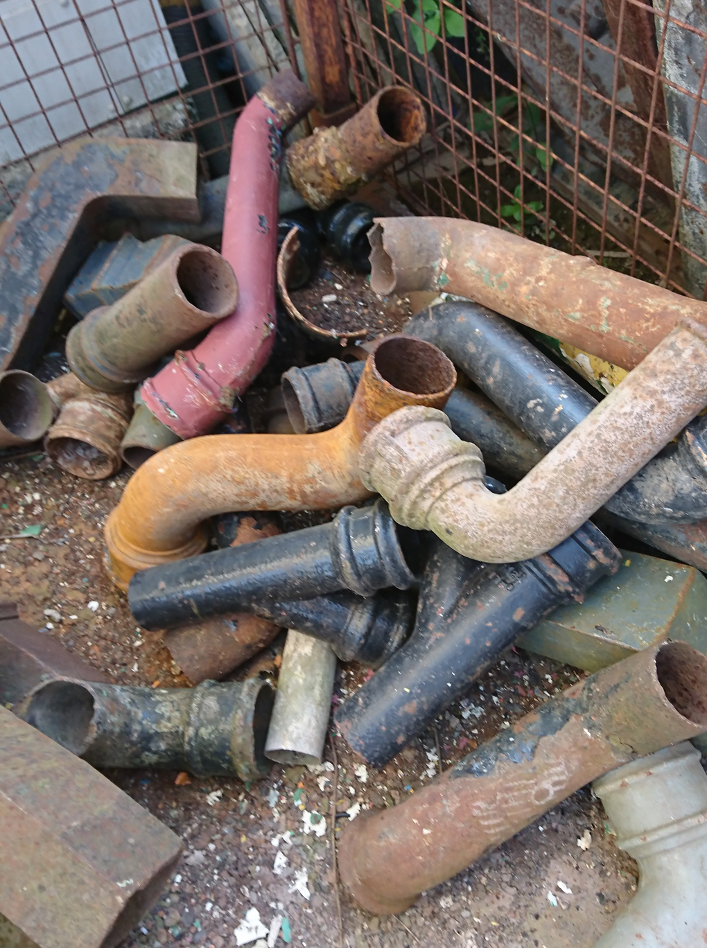 A collection of colourful pieces of pipe thrown down in heap at a Reclamation Yard. Could this be art? Aah we do such exciting things!!!!