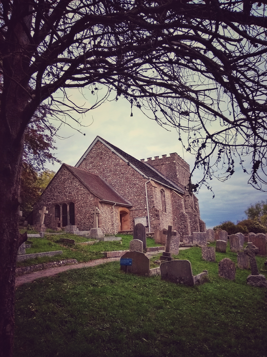 Medieval church, graveyard, tree