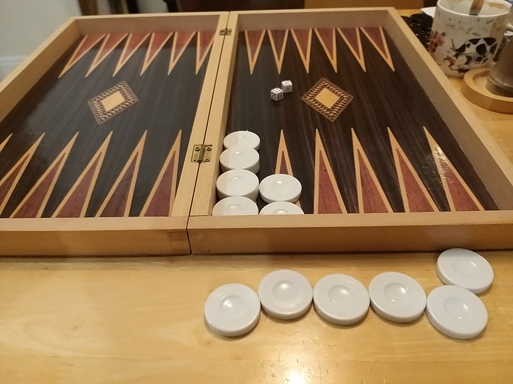 Backgammon set with all the opponents pieces removed.