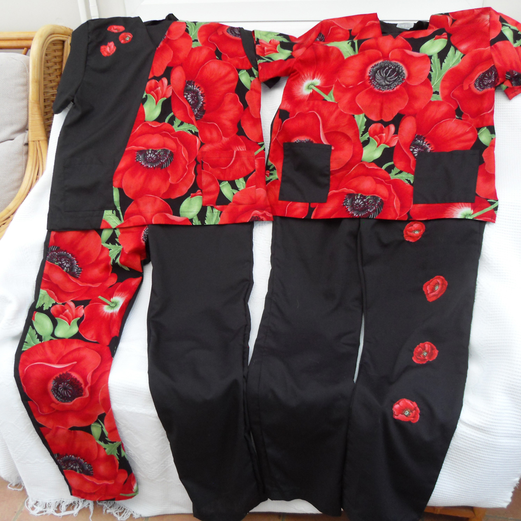 Two pairs of hospital scrubs featuring remembrance poppies