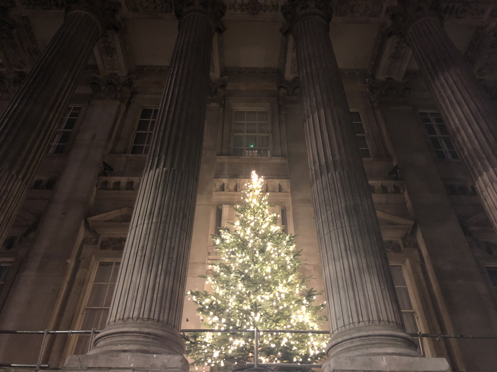 Lit up Christmas tree in front of the Bank of England