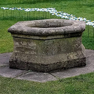 A display of metal forget-me-nots at Gloucester Cathedral.