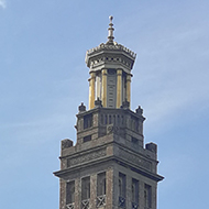 tower viewed through a graveyard