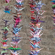 1000 paper birds hung on strings.