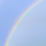 complete arch rainbow over houses