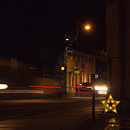 A Christmas star set against a long exposure of evening traffic on the Paragon in Bath.