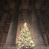 Lit up Christmas tree in front of the Bank of England
