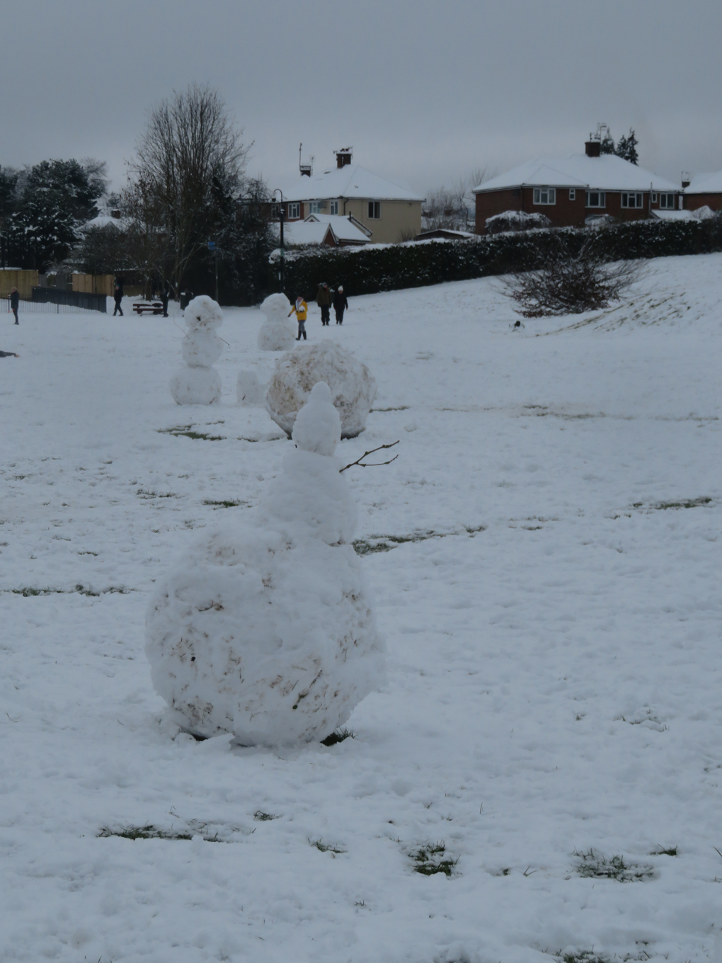 We see several snow men gathering together in Meadow Bank Dorking