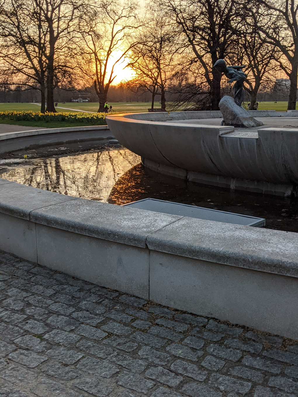 Sunset over a fountain at golden hour