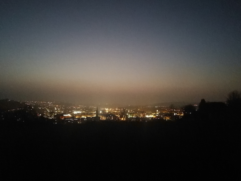 View across Bath at sunset with all the lights of the town turned on