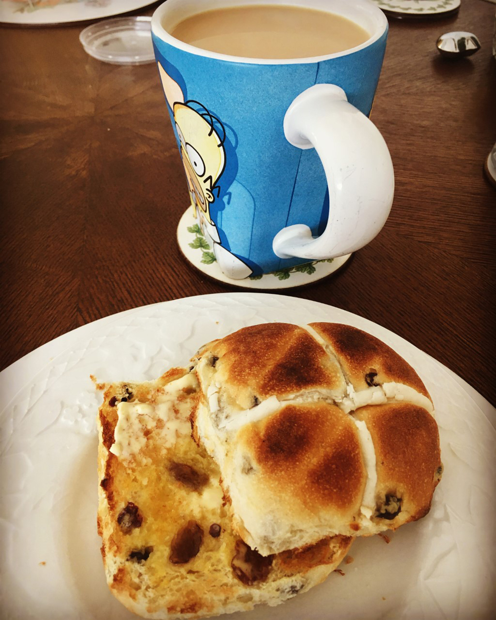 buttered hot cross bun and tea