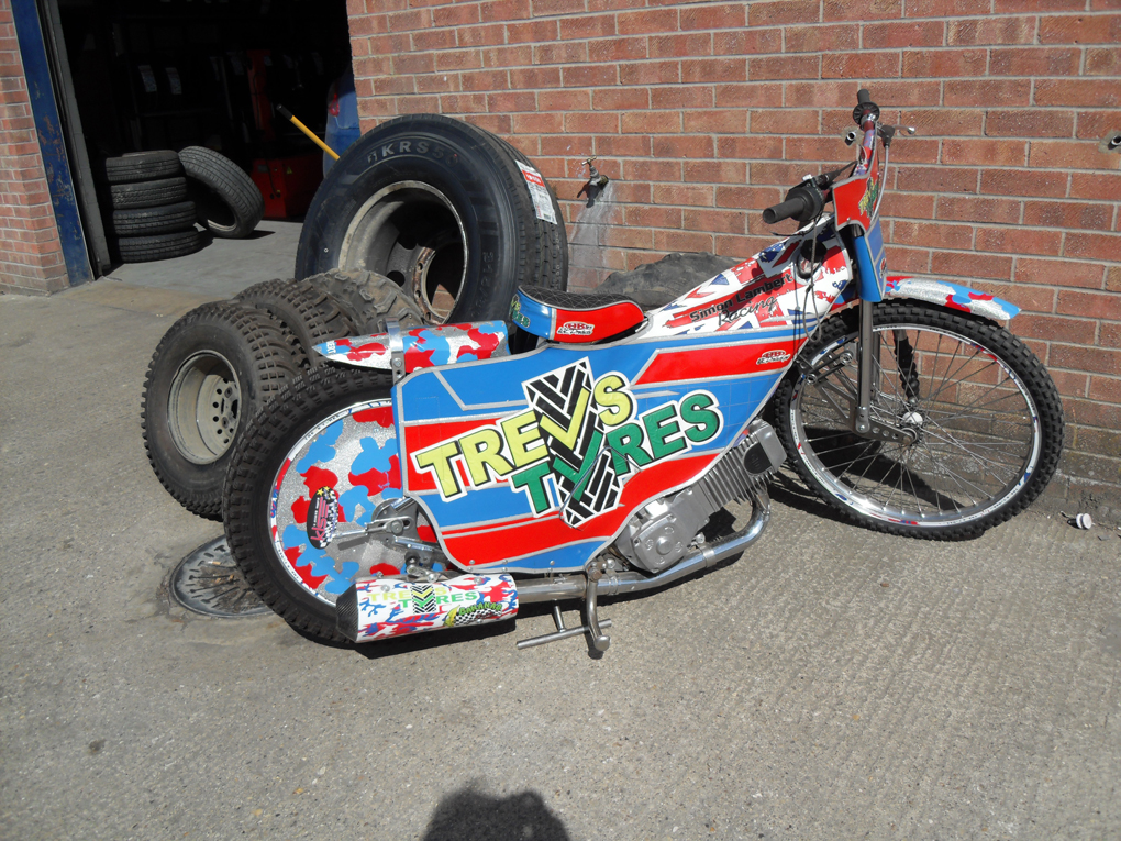 Brightly painted motorbike advertising local tyre fitting depot