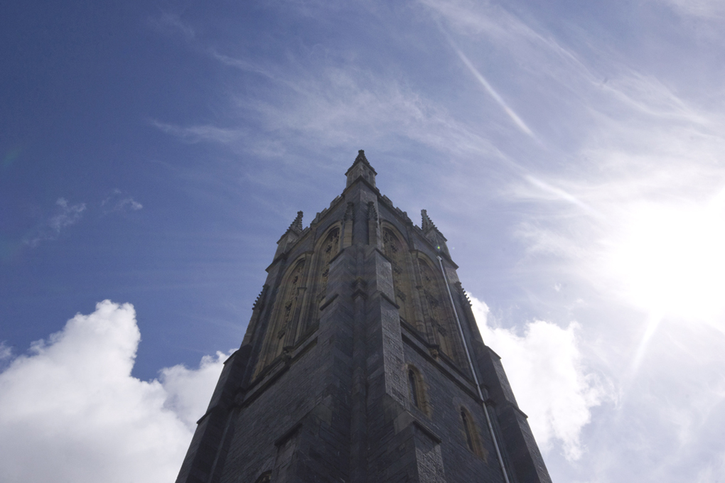 Church steeple against a deep blue sky.
