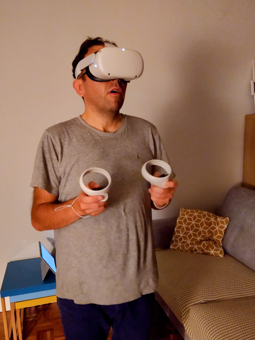 Man wearing a VR headset and an expression of wonder