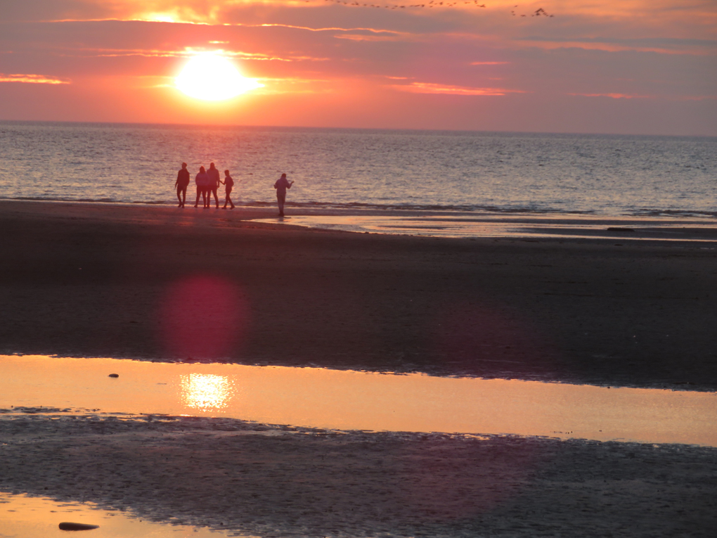 We see a beautiful late September sunset out to sea on the North Norfolk coast