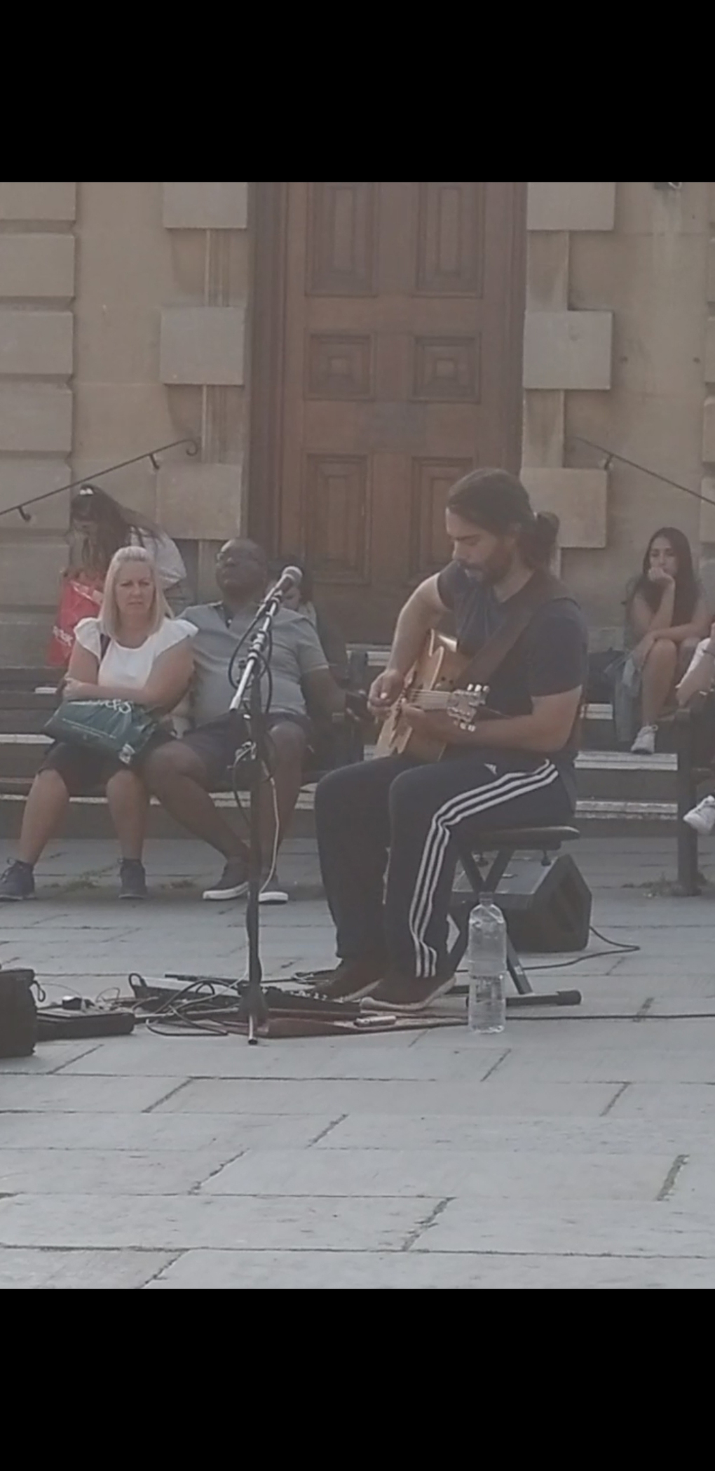Guitarist Matthew Lennox busking in the square