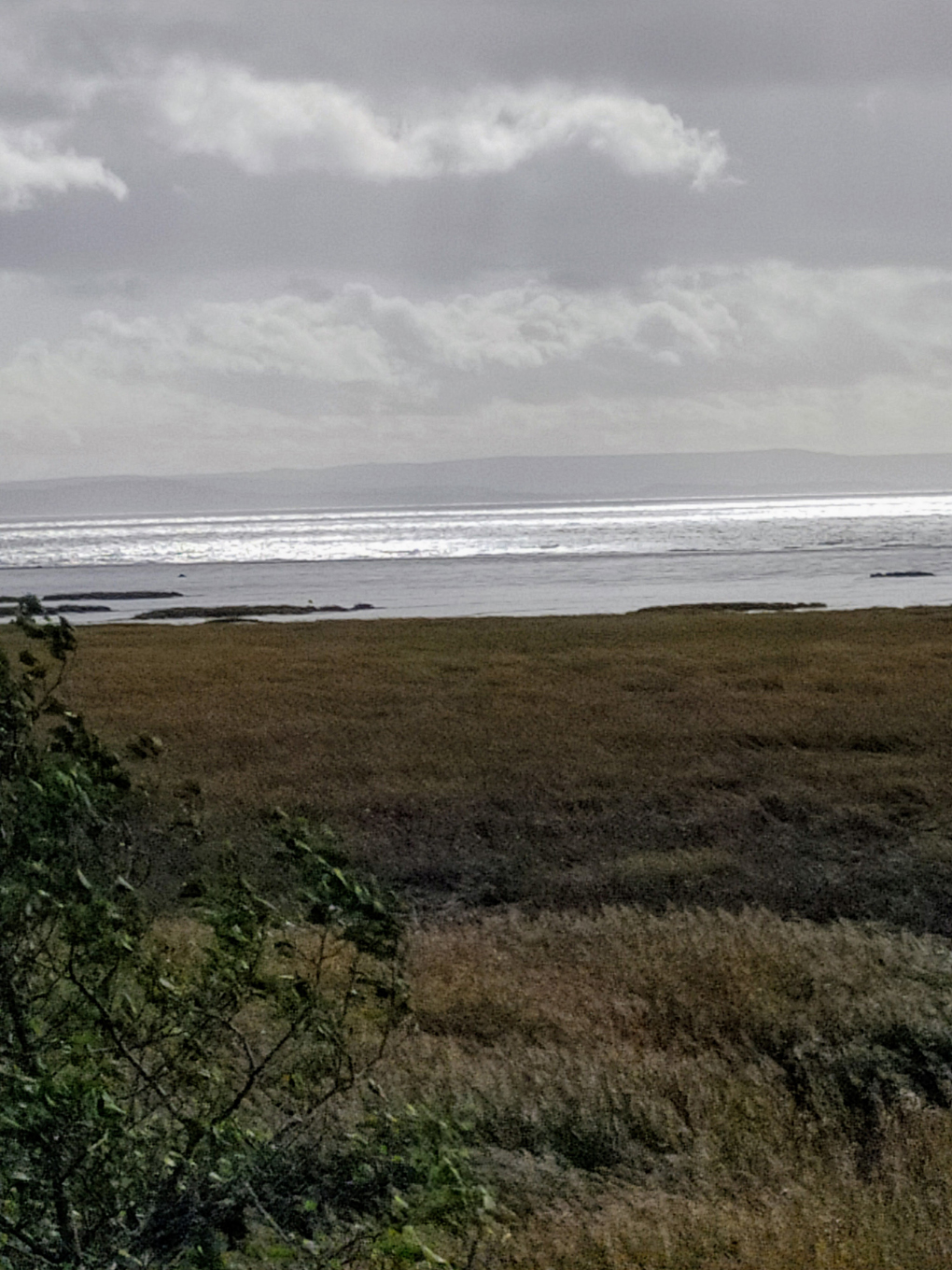 View over Bristol Channel looking at sunlight reflected from the sea.