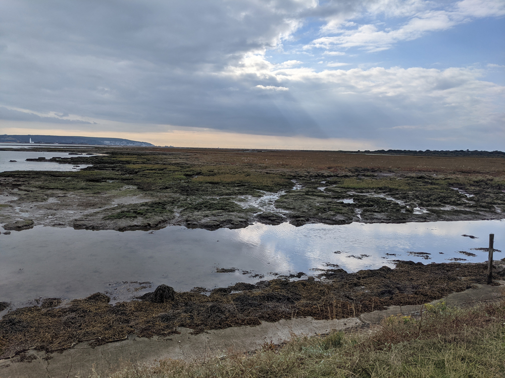 Looking across Lymington salt marshes over the Solent towards the Isle of Wight