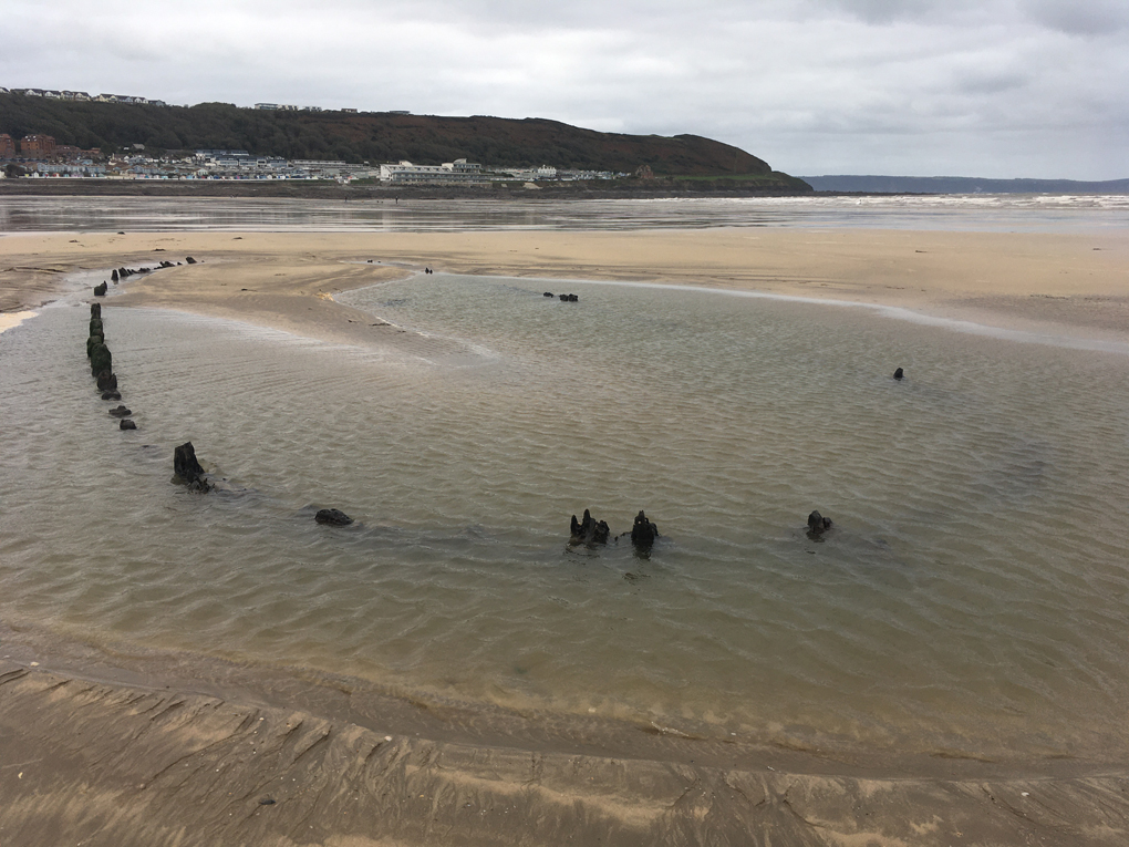 ship wreck covered in sand