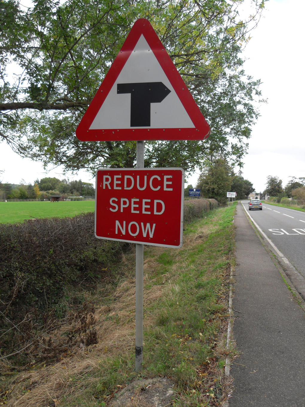 A road sign that looks like an ancient canon