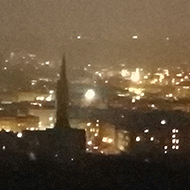 View across Bath at sunset with all the lights of the town turned on