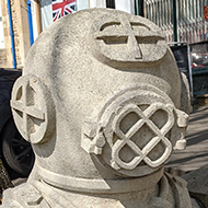 A stone replica of a diver's suit