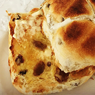 buttered hot cross bun and tea