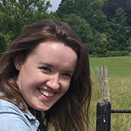 Me smiling in a field.