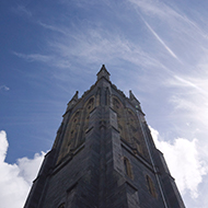 Church steeple against a deep blue sky.