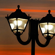 Lamp posts and McDonalds sign in a sunset