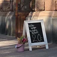 Pavement and shop windows.