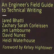 A stack of books titled 'Docs for Developers: An engineer's field guide to technical writing' on a bookshelf