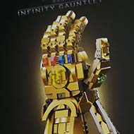 Collection of presents - LEGO Infinity Gauntlet, Baking book, Brass dice, wipe-clean notepad and pens
