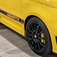 A bright yellow Abarth 595 Competizione on 17